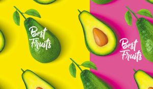 Fresh avocado halves on yellow and fuchsia background