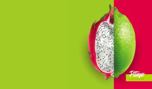 Two halves of a dragon fruit and a lime isolated on red and green