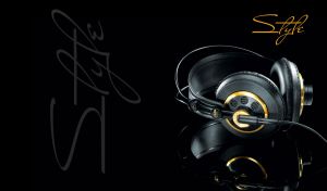 Stylish black and gold studio professional semi-open stereo headphones on black