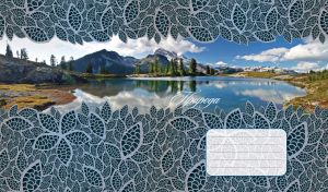 Landscape reflected in a winter lake in a grey textured frame of carved leaves