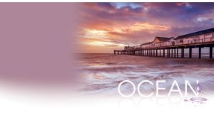 Southwold Pier waterscape over the foamy waves at a purple sunset