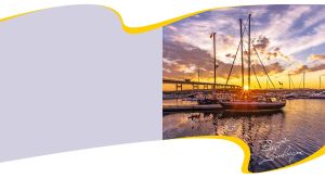 Golden sunset at the marina against gray and white background in a yellow frame