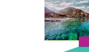 A view of a mountain village from the water in a frame on a white background