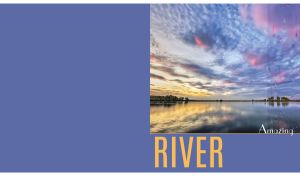 Riverscape with cirrus sunset clouds with raindrops on glass on light navy