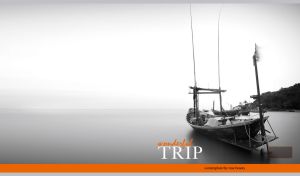 Monochromatic seascape of an old wooden boat against hazy water