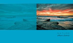 Majestic landscape of foamy waves on a rocky shore at sunset on a blue backdrop