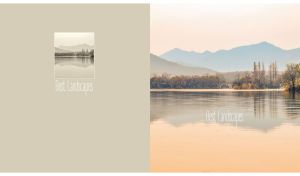 Tranquil lake view with autumn trees and hazy mountains