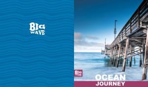 A wooden pier extending into the ocean under a serene evening sky on blue