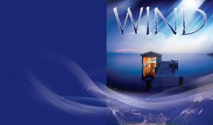 Sunny wind over wooden pier with illuminated boathouse on a calm lake on dark blue