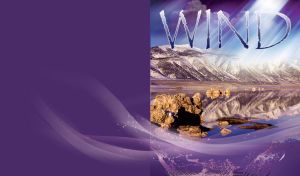 Sunny wind over mountain lake with snowy mountains and sharp rock on indigo