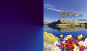 Mountains and their reflection in the blue lake with colorful flowers