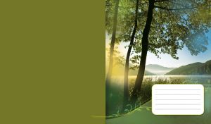 Green spring forest on the riverbank in the morning light against rolling hills