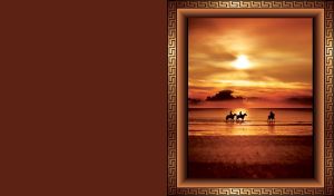 Silhouettes of horse riders walk along the beach on red brown