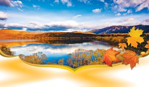 Landscape of a blue lake in the autumn forest, framed in orange leaves