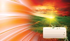 Cloudy sky with red dawn over grassy green meadow with radiant red to orange gradient