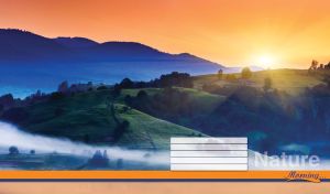 Valley hills shrouded in morning fog and a mountain range on the orange horizon