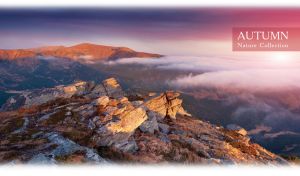 Autumn fog over the mossy and rocky mountains against a purple-blue sunset