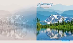 Blue mountains and a forest reflected in a lake in pastel white and blue hues