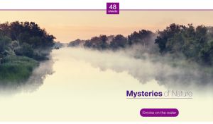 Green forest on the bank of a mysterious placid foggy river in morning lights