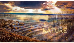 Rippling lake against the sunbeams and dark clouds at sunset