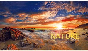 Rocky shore in foamy seawater against the blue sky at a golden dawn