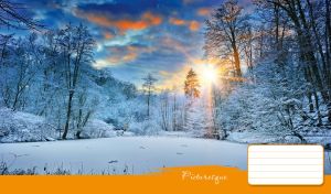 Picturesque view of a winter lake and frozen trees in the morning light