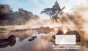 Panoramic view of pastel beige haze over the water at dawn