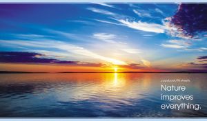 Scenic landscape with a majestic sunset over a blue lake