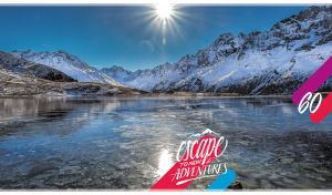 Winter scenery with melting ice lake in morning sunlight
