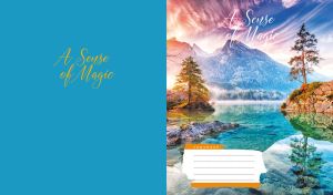 A tranquil alpine lake reflects the misty mountains under a magical sky on blue