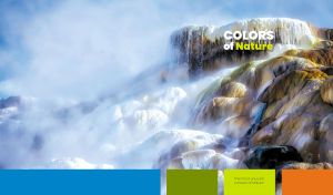 Ethereal hot springs shrouded in steam against a blue sky