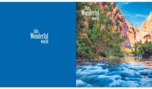 Tranquil river winding through a sunlit canyon on blue