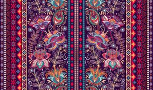 Ethnic boho seamless pattern with paisley flowers in purple and red shades