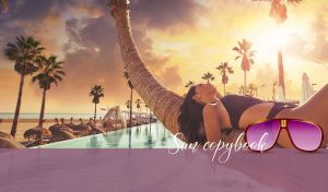 Tropical scene with a woman lying on a palm tree at sunset