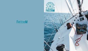 Sailing yacht on the open sea under bright blue skies on soft blue