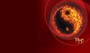 Yin and Yang symbol made of yellow-orange flame on a maroon-red gradient