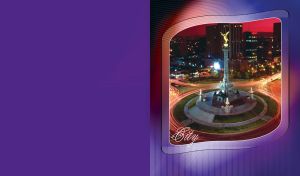 Night cityscape with large round square and a tall statue with a golden angel