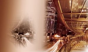 Night view from a glass balcony on an illuminated office skyscraper