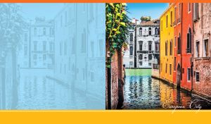 Ocher, yellow and white buildings with arched windows lined the canal in Venice