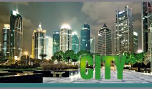Night view of illuminated skyscrapers against the teal sky in Shanghai