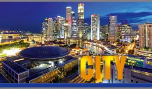Night view of illuminated skyscrapers against the navy blue sky in Singapore