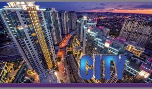 Night view of illuminated skyscrapers against the violet sky in Kyiv, Ukraine