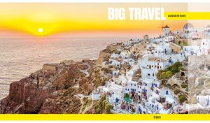 European scenery of Oia town on Santorini island at a yellow sunrise