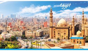 Panoramic view of a Egyptian cityscape with historic mosques on beige and blue