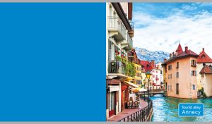 An atmospheric view of the old town of Annecy on a blue backdrop