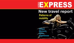 Blonde supermodel rides a black Harley Davidson on the cover of travel magazine