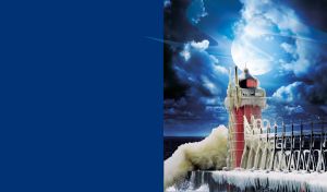 Red lighthouse on a ice-covered bridge shines in the silver moonlight