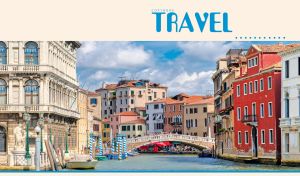 A panoramic view of a bridge and building on the Grand canal in Venice, Italy