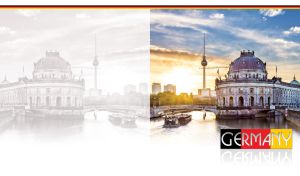 A ship sails down the river, passing the Bode Museum at sunset