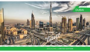Panoramic view of Dubai at dusk on the cover of a travel magazine
